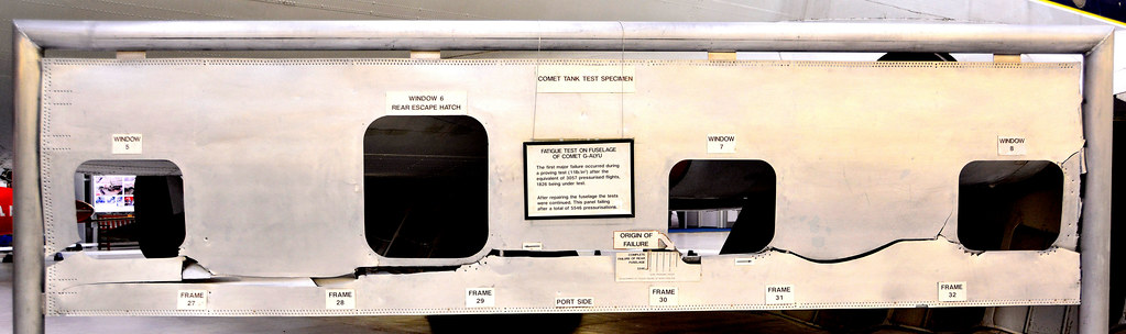 Torn and buckled aluminium fuselage skin on a de Havilland Comet fatigue-test section at RAF Museum Cosford